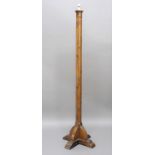 ARTS & CRAFTS OAK STANDARD LAMP in the style of Mouseman, of octagonal shape with a fluted column