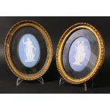 PAIR OF WEDGWOOD BLUE JASPER PLAQUES, 19th century, each of a maiden with a cornucopia or a peacock,