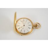 AN 18CT. GOLD FULL HUNTING CASED POCKET WATCH BY RUSSELLS LTD. the signed white enamel dial with