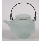 •EDMUND DE WAAL (BORN 1964) a porcelain teapot with a celadon glaze and delicate crackle, mounted