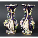 PAIR OF ENGLISH PORCELAIN FLORAL ENCRUSTED VASES, late 19th century, probably Minton, with a
