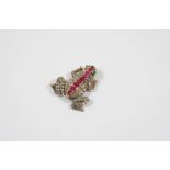 A VICTORIAN DIAMOND AND GEM FROG BROOCH realistically formed, the body mounted with rose-cut