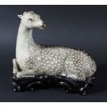 CHINESE PORCELAIN FIGURE OF A RECUMBENT DEER, probably 19th century, with dappled brown fur, lacking