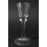 WINE GLASS, circa 1750, the rounded bowl above a balustroid stem with flattened shoulder knop and