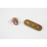 A VICTORIAN 15CT. GOLD AND GEM SET BROOCH the gold brooch with rope and ball decoration and