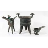 CHINESE BRONZE RITUAL VESSEL, jia, with scrolling decoration, on three legs, height 23cm; another,