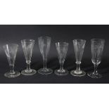 GROUP OF SIX ALE GLASSES, late 18th or early 19th century, the drawn trumpet bowls engraved with
