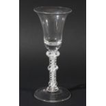 WINE GLASS, circa 1760, the bell bowl with a solid base on a double series opaque twist stem with