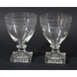 PAIR OF RUMMERS, circa 1800, the rounded bowls with polished oval and engraved star decoration on