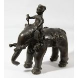 INDIAN BRONZE FIGURE OF A MAHOUT ON ELEPHANT BACK, 19th century, with chained ankles and shortened