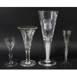 GEORGE III WINE GLASS, circa 1760, the ogee bowl with faceted base above a knopped, faceted stem and