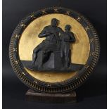 BLACK BASALT AND GILT CIRCULAR PLAQUE, 19th century, possibly Wedgwood, depicting a bearded,