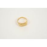 AN 18CT. GOLD SIGNET RING of rectangular shape, 7.9 grams, size N.