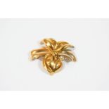 AN 18CT. GOLD FLOWERHEAD BROOCH realistically formed, 5.5cm. wide, 11.9 grams.