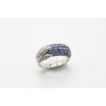 A SAPPHIRE AND DIAMOND RING the half hoop ring is mounted with one side with sections of circular-