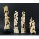 GROUP OF FOUR JAPANESE CARVINGS, circa 1900, probably bone, of men at various activities, some