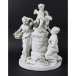 NAPLES PORCELAIN CENTREPIECE, of two cherubs and two maidens around a column, in white, signed '