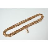 A LONG 9CT. GOLD WATCH CHAIN formed alternately with straight and rope links, 150cm. long, 44