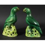 PAIR OF CHINESE MING STYLE PARROTS, probably 20th century, green glazed and standing on