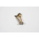 A VICTORIAN DIAMOND HARP BROOCH mounted with graduated old brilliant-cut diamonds, set in silver and