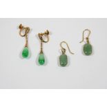 A PAIR OF JADE AND GOLD DROP EARRINGS each jade drop suspends from a gold surmount, with screw