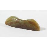 CHINESE GREEN AND RUSSET JADE MOUNT, perhaps 18th century, of slender form carved with the head of a