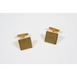 A PAIR OF 18CT. GOLD CUFFLINKS of square-shape with engine turned decoration, 14.9 grams.