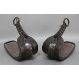 PAIR OF EASTERN BRONZE STIRRUPS, possibly Chinese, inlaid with a foliate design, length 27cm (2)