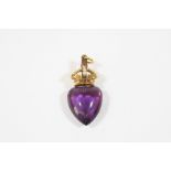 A 19TH CENTURY AMETHYST HEART-SHAPED PENDANT the heart-shaped amethyst suspends from a seed pearl