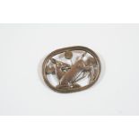 A SILVER BROOCH BY GEORG JENSEN depicting a deer amongst foliate, design no. 256, signed to the