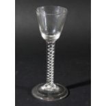 GEORGIAN WINE GLASS, the rounded funnel bowl above a single series air twist stem of two spiral