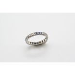 A SAPPHIRE AND DIAMOND FULL CIRCLE ETERNITY RING set alternately with sections of three calibre-