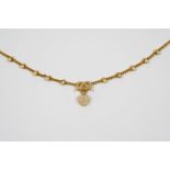 A VICTORIAN PEARL AND GOLD NECKLACE the gold curb link necklace is mounted with ten half pearls in