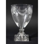 GLASS GOBLET, circa 1800, the tapering bowl with engraved oval and swag decoration, knopped, short