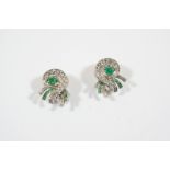 A PAIR OF DIAMOND AND EMERALD EARCLIPS BY J.E. CALDWELL of scrolling design, each mounted with a