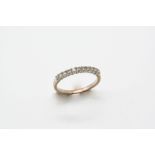 A DIAMOND HALF HOOP RING set with circular-cut diamonds, in white gold. Size N.