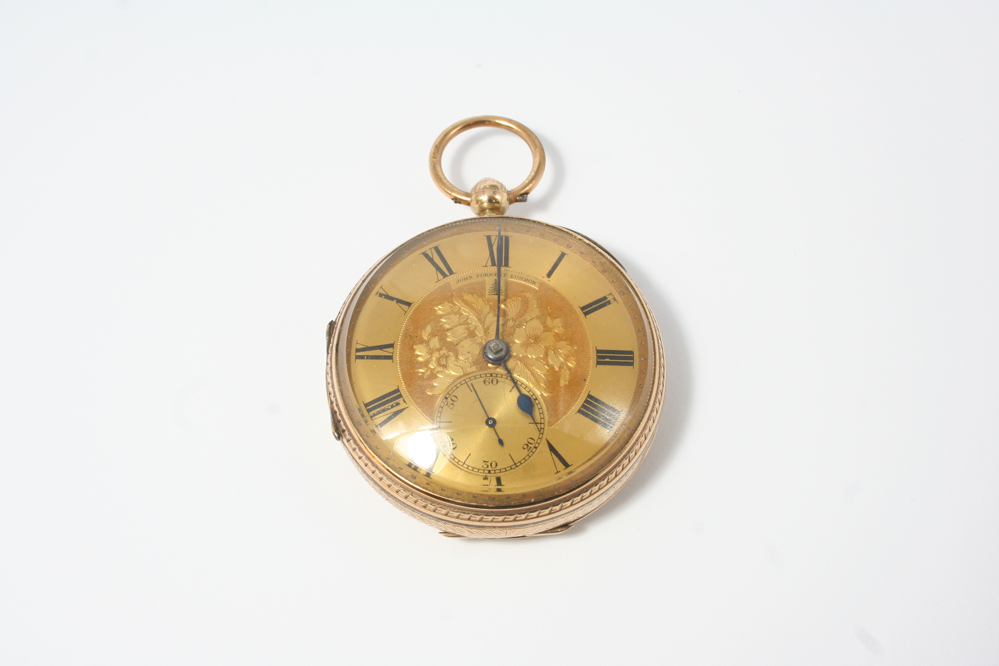 A 9CT. GOLD OPEN FACED POCKET WATCH BY JOHN FORREST, LONDON the signed gold dial with foliate