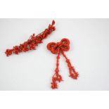 A VICTORIAN CORAL BROOCH of bow and tassel design, 10cm. long, together with another Victorian coral