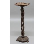 CHINESE CARVED LAMP TABLE, 19th century, the leaf-shaped top with insects above a pierced stem and