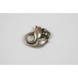 A SILVER BROOCH BY GEORG JENSEN formed as two tulips, design number 100A, with maker's mark and