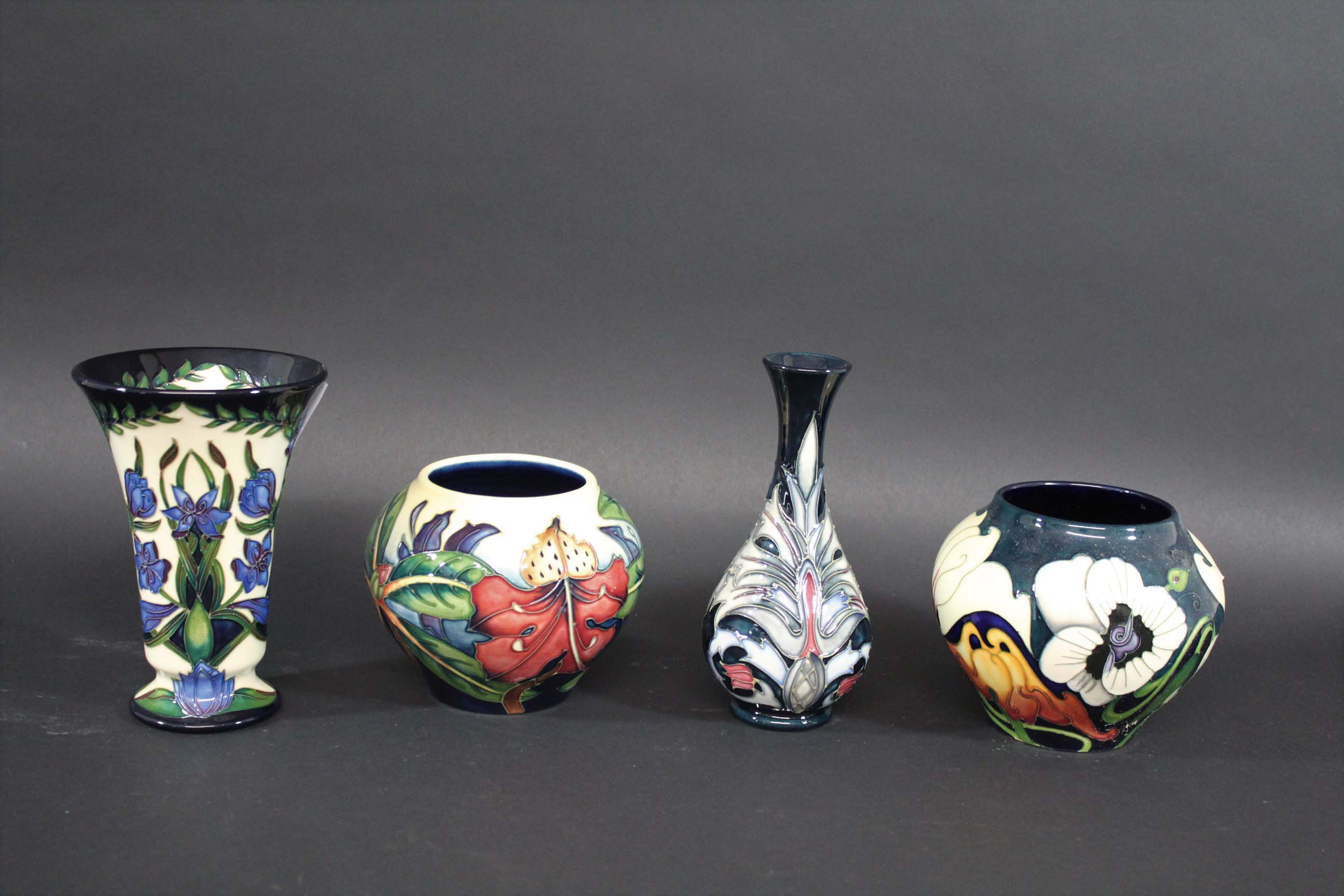MOORCROFT VASES 4 modern Moorcroft vases including one in the Kaffir Lily design, designed by