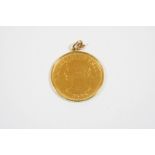 A CHILEAN 100 PESOS COIN 1926, in a gold pendant mount, total weight 22.1 grams.