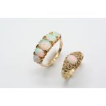 AN OPAL FIVE STONE RING the five graduated oval-shaped solid white opals are set in 18ct. gold, size