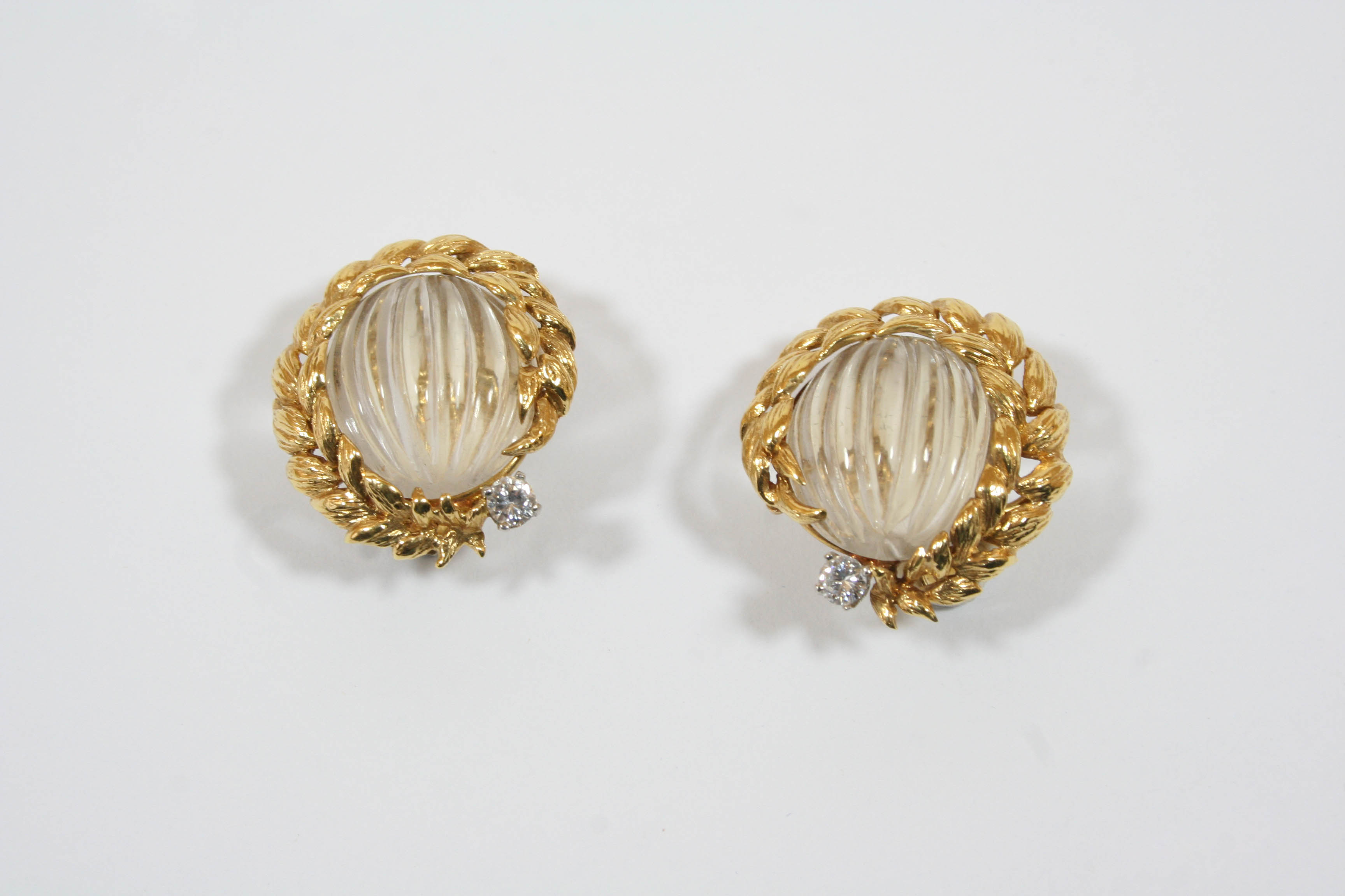 A PAIR OF 18CT. GOLD, CRYSTAL AND DIAMOND EARCLIPS BY DAVID WEBB each formed with an oval carved