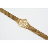 A LADY'S 9CT. GOLD WRISTWATCH BY TUDOR ROLEX the signed white enamel dial with baton numerals, on