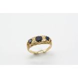 A SAPPHIRE AND DIAMOND RING the three graduated circular-cut sapphires are set with four single-