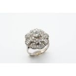 A DIAMOND CLUSTER RING the central circular-cut diamond is set within a double surround of