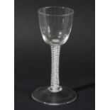 WINE GLASS, circa 1770, the rounded bowl on a double series opaque twist stem with a central gauze