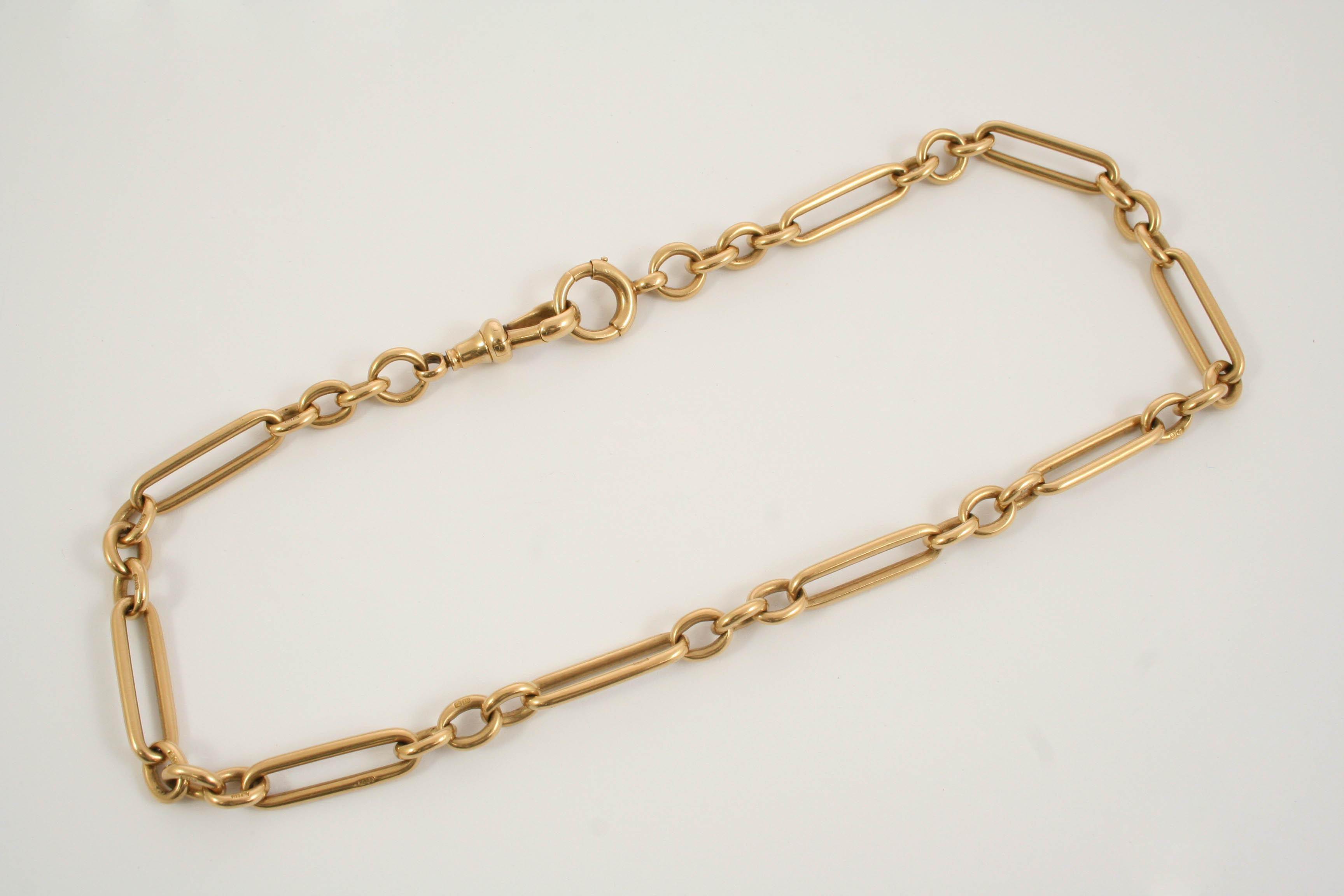 AN 18CT. GOLD WATCH CHAIN formed with long and short links, 36.5cm. long, 44.4 grams.