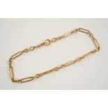 AN 18CT. GOLD WATCH CHAIN formed with long and short links, 36.5cm. long, 44.4 grams.